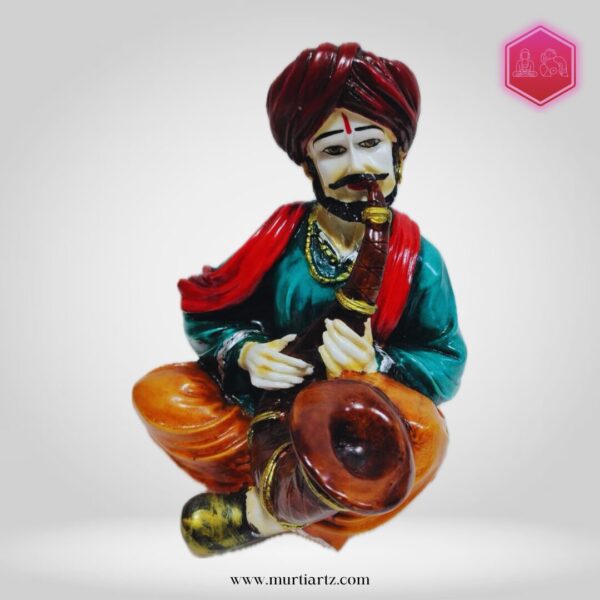 Decorative Rajasthani musician sculpture, adding a touch of Rajasthani flair to your living space.