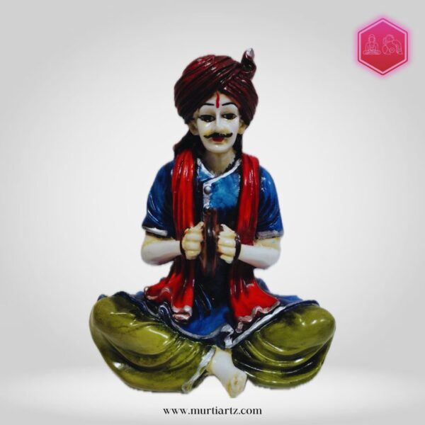 Decorative Rajasthani musician sculpture, adding a touch of Rajasthani flair to your living space.