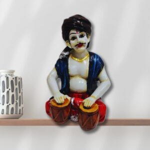 Decorative Rajasthani musician sculpture, adding a touch of Rajasthani flair to your living space.