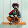 Decorative Rajasthani musician sculpture, adding a touch of Rajasthani flair to your living space.