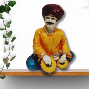 Decorative Rajasthani musician sculpture, adding a touch of Rajasthani flair to your living space.