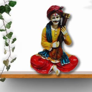 Decorative Rajasthani musician sculpture, adding a touch of Rajasthani flair to your living space.